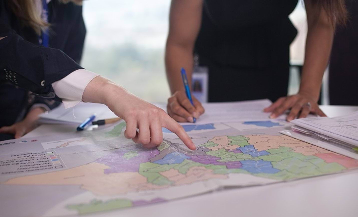 Woman pointing at map